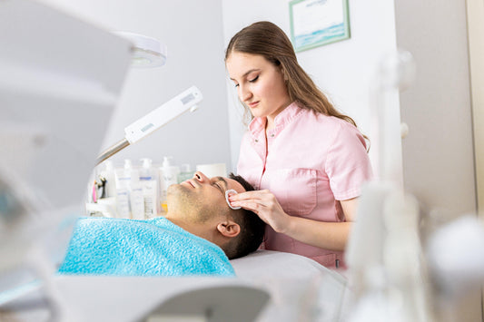 beautician-doing-face-treatment-in-beauty-salon to a patient